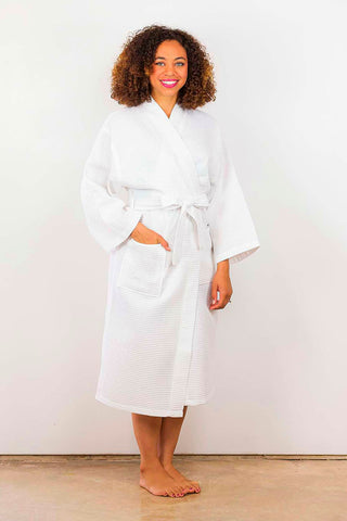 Woman wearing a long white robe.